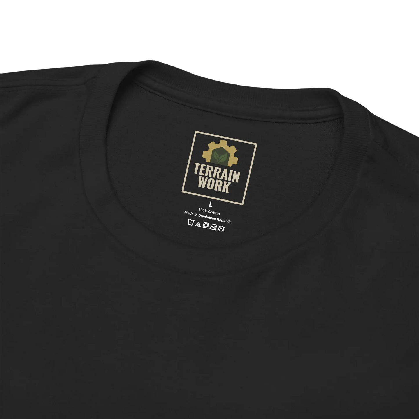 Inner neck label of black TERRAINWORK tee, featuring logo and printed size on Gildan 5000 cotton shirt