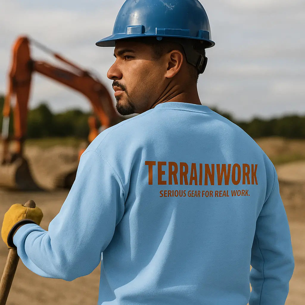 Light blue crewneck sweatshirt with TerrainWork logo, worn by hispanic construction worker